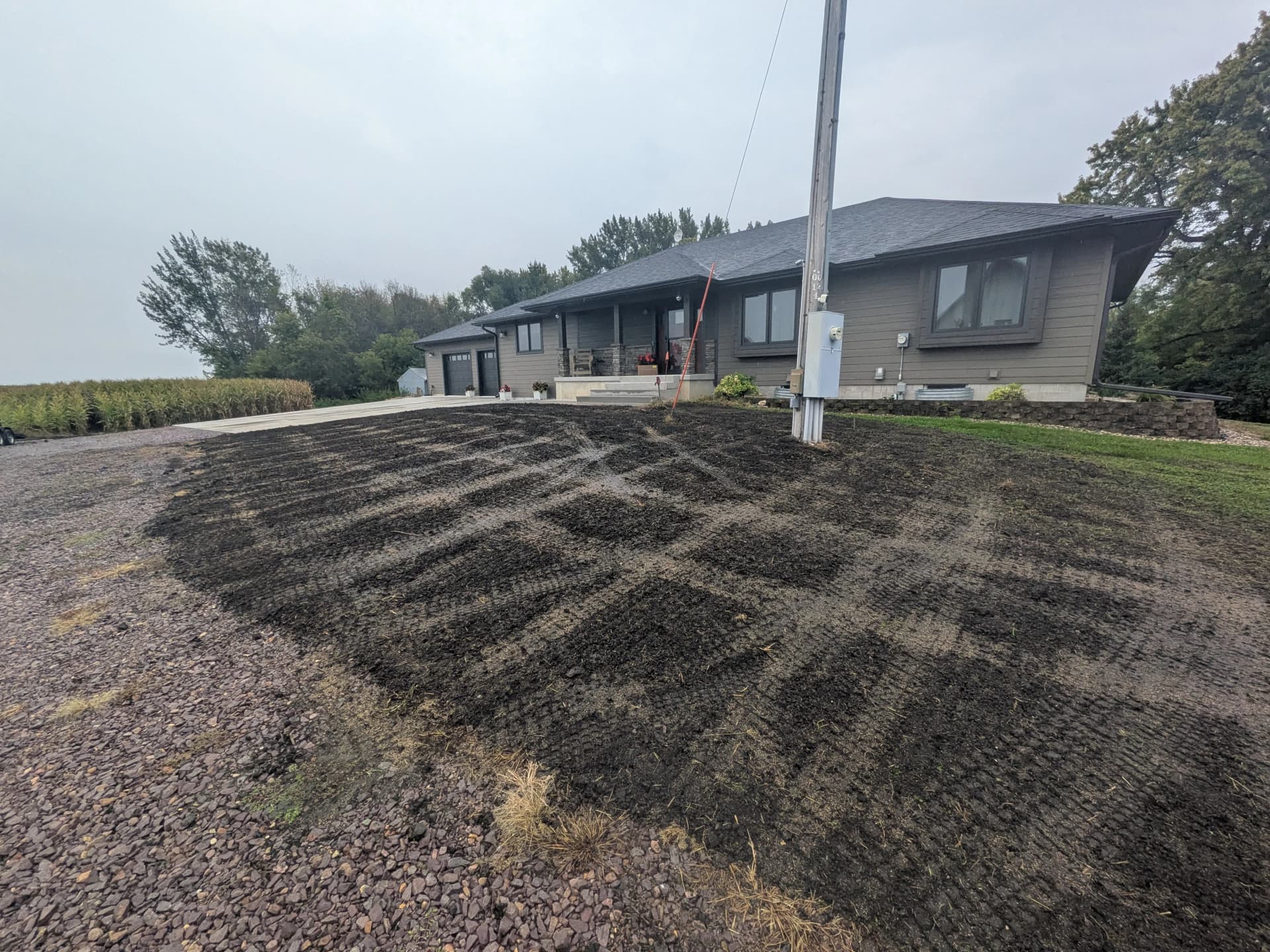 Finish Grading and Lawn Seeding Prep Around a Rural Home image